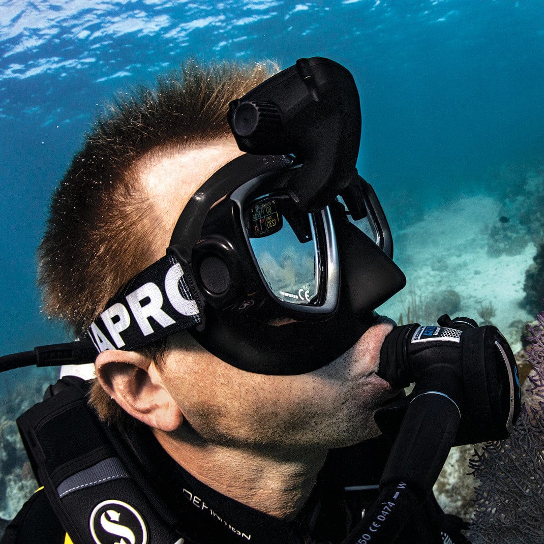 Scuba diver underwater with mask and regulator.