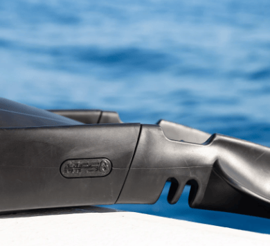 Black diving fin detail with ocean background