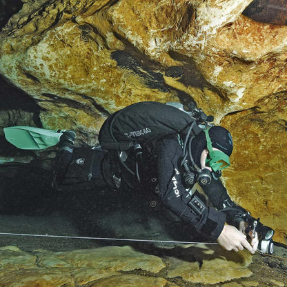 Scuba diver in cave with S-Tek Donut 60 gear.