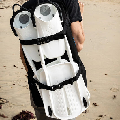 BCD carry bag with fins on person at beach