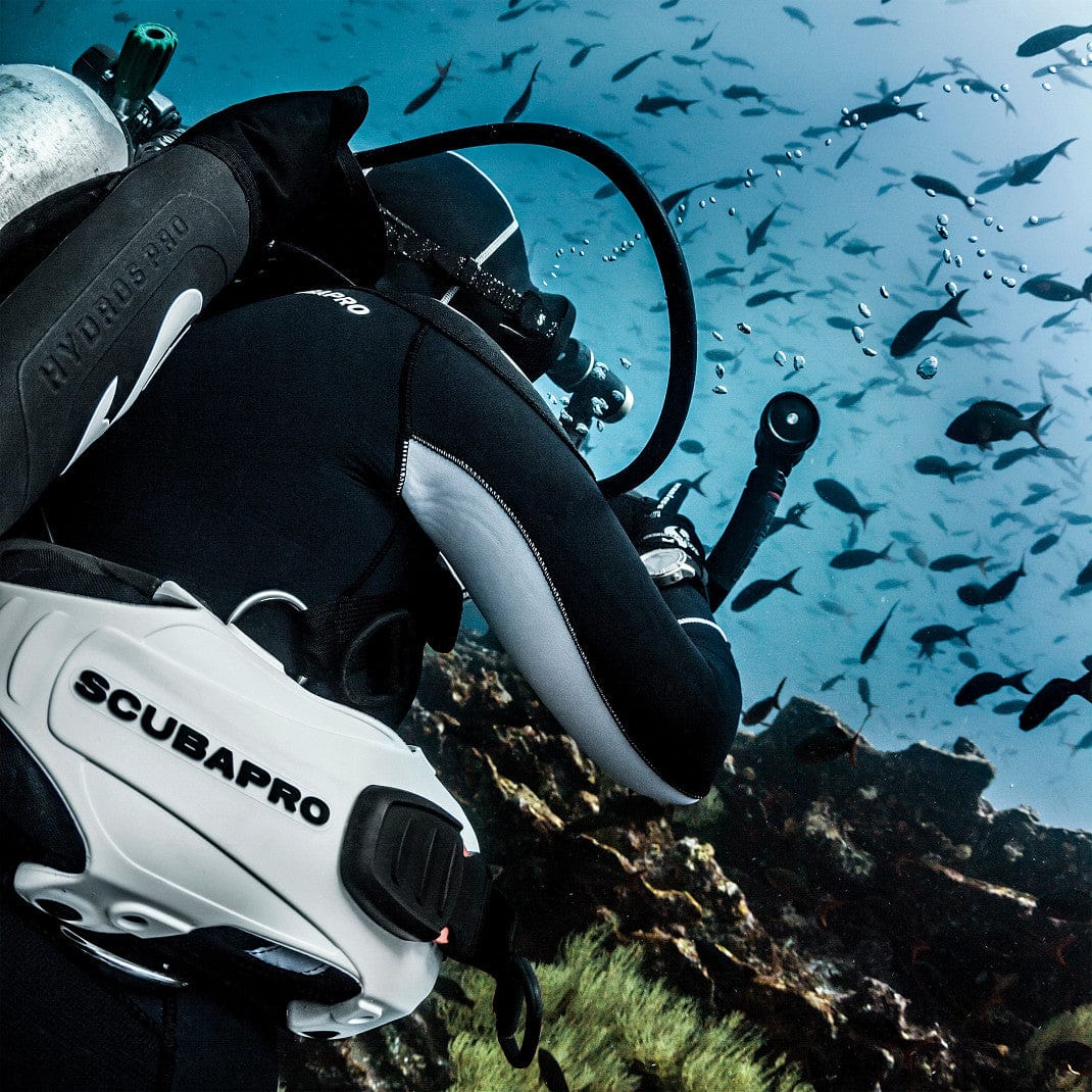 Scubapro diver underwater with fish